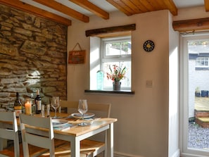 Beamed kitchen/dining room | Noddfa Cottage, Llanfairtalhaiarn, near Abergele