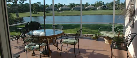Family room opens onto screened lanai.  Views of water, golf, otters, birds, mor