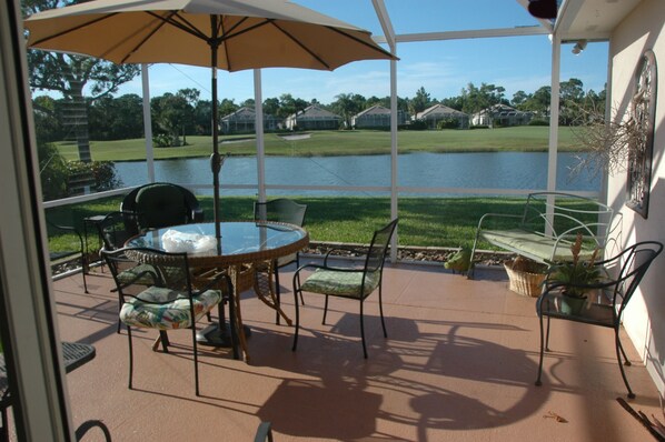 Family room opens onto screened lanai.  Views of water, golf, otters, birds, mor