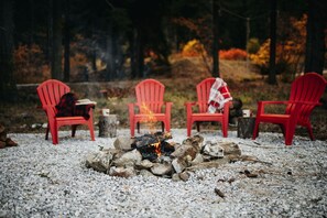 Fall by fireside with a mountain, valley view. 