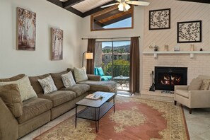 This condo has an open-plan layout fireplace non operational
