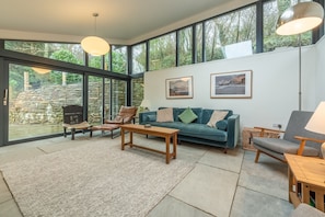 Upper ground floor: Family room with large sliding doors out into the gardens