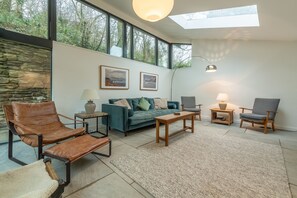 Upper ground floor: Family room with television and wood burning stove