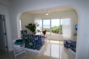 The perfect room to watch the Caribbean lapping at the shore just paces away.