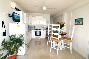 Kitchen with dinette is perfect for a quick snack or to prepare full meals. 