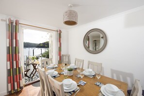 Waterfront House, Malpas. Ground floor: Dinning room with seating for eight