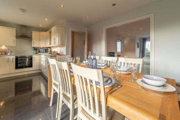 Sea Folly, Perranporth. First floor: Dining room with table and seating for ten and doors to balcony