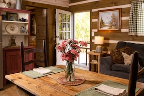 Cozy cabin table, open area for dining and lounging.