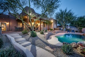 The back of Casa Puesta Del Sol, beautifully lit at night