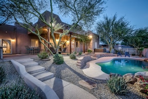 The back of Casa Puesta Del Sol, beautifully lit at night