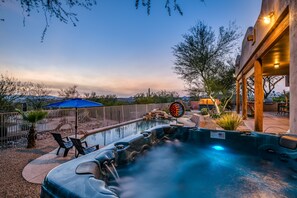 Backyard oasis features 56 jet hot tub, pool, cantina, fire pits, and grill area