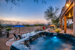 Backyard oasis features 56 jet hot tub, pool, cantina, fire pits, and grill area