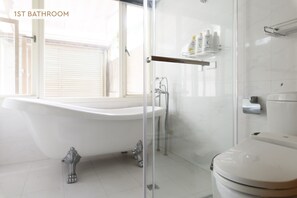 Bathroom 1 (Main Floor): 
• Bathtub & Shower 
• Essential Toiletries & Towels