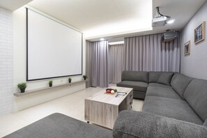 Spacious Living Room: 
• Large Comfy Sofa
• Projector & Screen
• Audio System 

