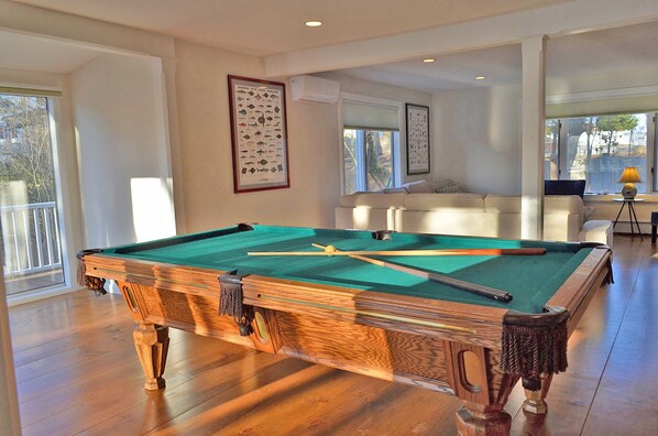 The spacious living room is also a game room.