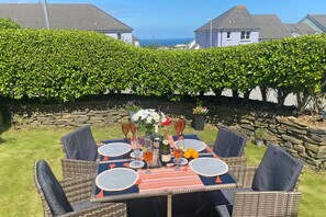 Enjoy Al Fresco dining in the garden with the sea breeze