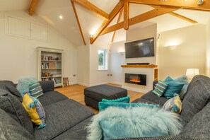 Westerley, Portreath. Upper ground flour: Sitting room with electric fire, smart television, comfortable seating and doors to patio