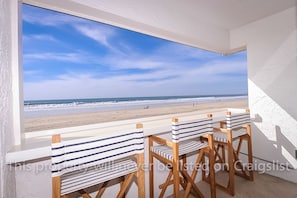 The balcony that overlooks the patio. Beautiful Panoramic Ocean & Beach views 