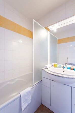 Get ready for the day in the bright bathroom.