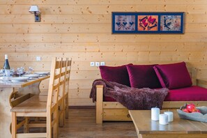 In the living area, there is a single sofa bed with a pull-out bed.