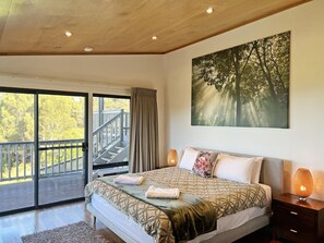 Master bedroom with own TV and deck access.