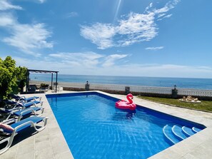 Large Private Pool (9m x 4.5m) with 8 sunbeds overlooking the beach and Sea