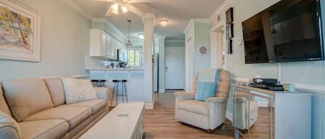 Family Room looking toward kitchen, entrance and breakfast bar