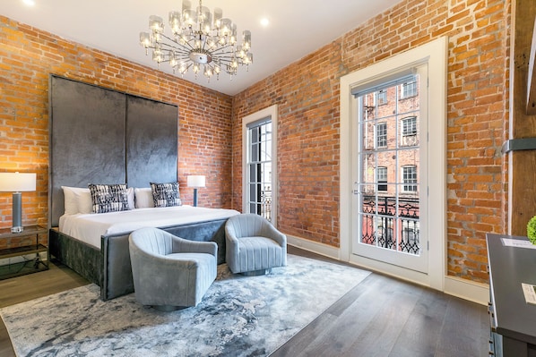 Spacious master bedroom with king-size bed, ensuite bathroom, and designer built-in closets. Equipped with hangers, luggage racks, white noise machine, and a 55'' Samsung Smart 4K TV with streaming and DIRECTV Entertainment. Plus, a private balcony!