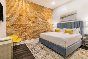 Spacious guest bedroom with a king-size bed and built-in closet. Includes nightstands, lamps, hangers, luggage rack, alarm clock, white noise machine, and a 50'' Samsung Smart 4K TV for streaming and DIRECTV.