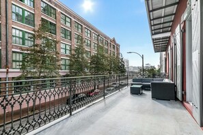 Extra deep balcony with cozy sectional and coffee table. Perfect for morning and evening relaxing!
