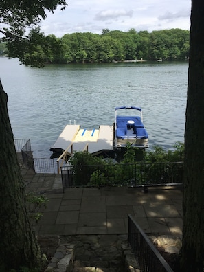 Private dock with the pontoon boat
