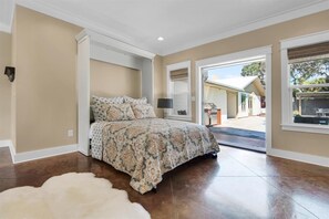 Queen Murphy Bed in Carriage House step out to the pool & private courtyard.