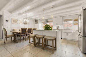 Three comfortable stools at the kitchen bar.