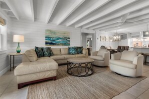 Inviting & comfortable open living room with leather sectional in main house.