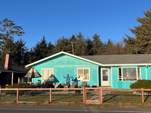 Street view of the home and fenced yard.
