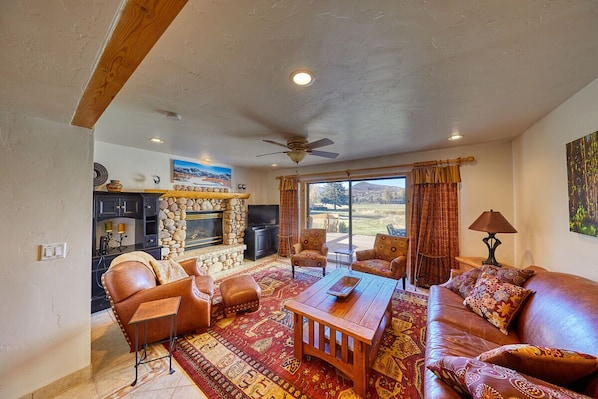 Living Room with gas fireplace and great view!