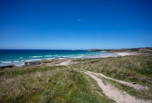 Surrounded by 3 Miles of sand dunes and beach you'll always find a spot