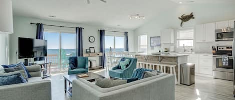 Top floor living and kitchen with ocean front deck. Gorgeous, airy, updated!
