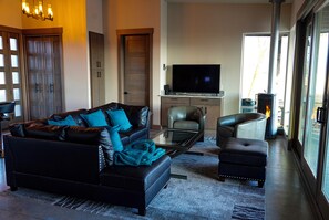 Front room with stunning pond and Rocky Mountain views