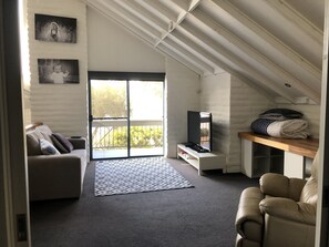 Upstairs living room with sofa bed for guests
