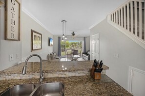 Kitchen overlooking dining and living room