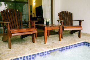 The jacuzzi, is located within the apartment.