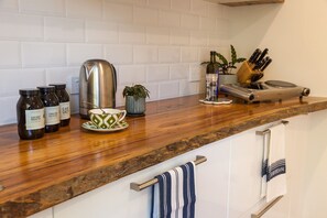 Electric cooktop, microwave, fridge, pots and pans, cutlery & Crockery provided