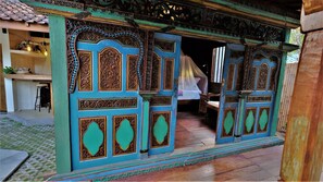 the front panel wall with old crafted teak wood