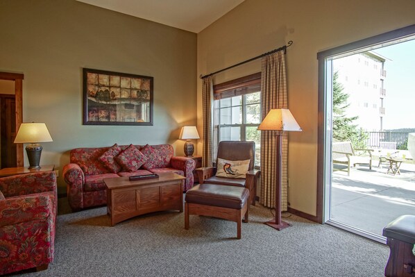 Living room with a queen sleeper sofa and gas fireplace
