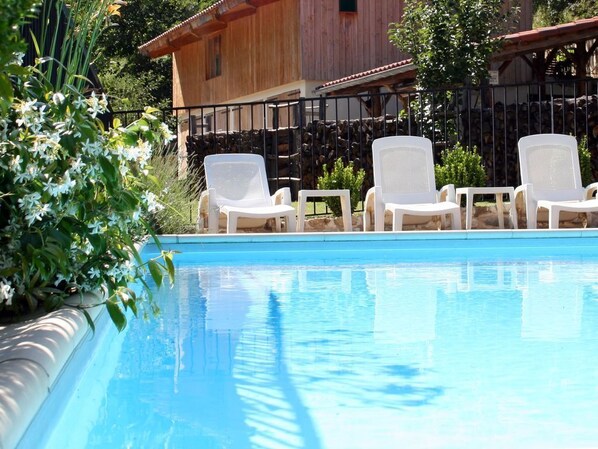 A fenced, child-friendly swimming pool, with wonderful views of the forest ...