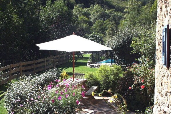Private entrance and terrace overlooking the garden, forest and stream