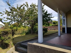 Veranda at the front of the house and large front garden