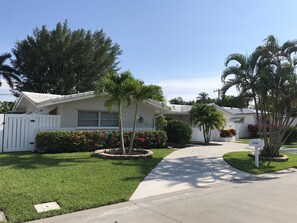 Freshly painted exterior with new palm trees 