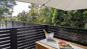 Outdoor dining set, near front gate.